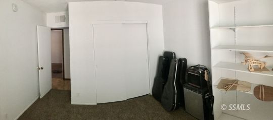 509 South Helena Street Ridgecrest, CA 93555 - Photo 23 of 40 a view of walk in closet with clothes and shoes