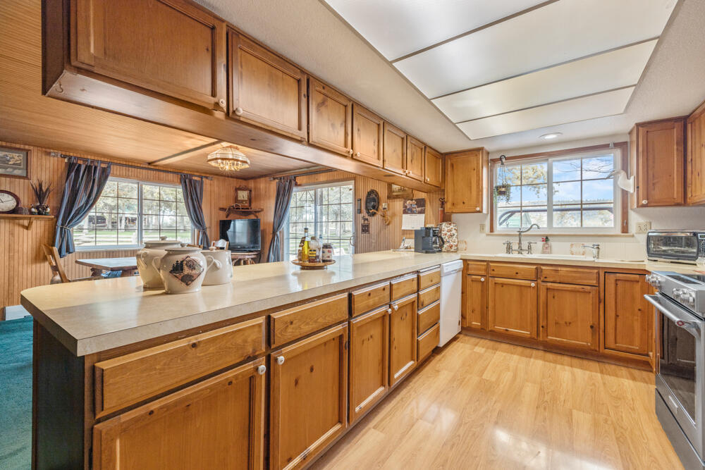 47477 Gerber Road Bonanza, OR 97623 - Photo 56 of 63 a kitchen with stainless steel appliances granite countertop a sink and cabinets