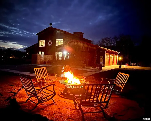 a view of a chairs and table in the balcony