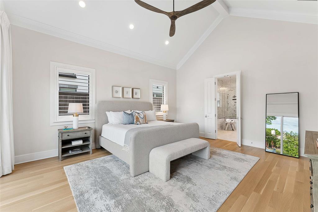 7110 Robin Road Dallas, TX 75209 - Photo 17 of 36 a spacious bedroom with a bed and a couch