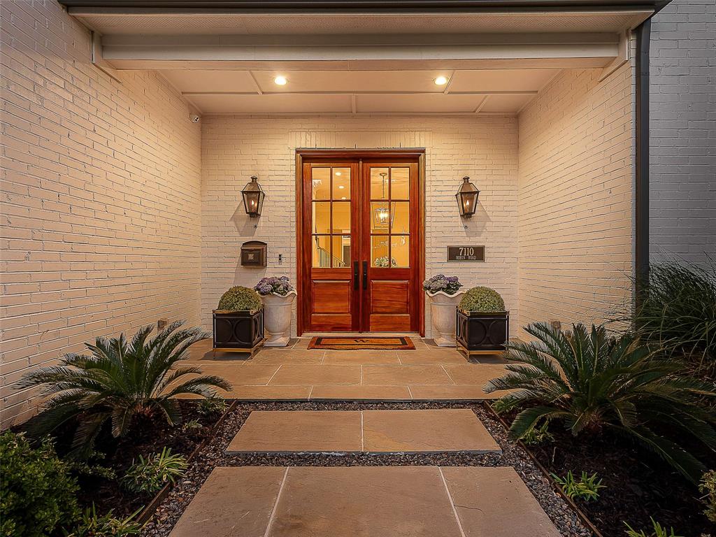 7110 Robin Road Dallas, TX 75209 - Photo 2 of 36 a view of a room with potted plants and couches