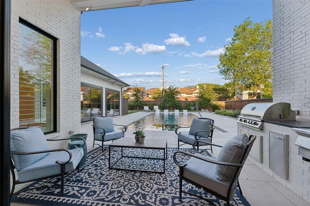 7110 Robin Road Dallas, TX 75209 - Photo 23 of 36 a outdoor space with patio the couches and a potted plant on the table