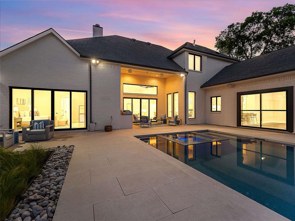 7110 Robin Road Dallas, TX 75209 - Photo 28 of 36 a view of a house with swimming pool and sitting area