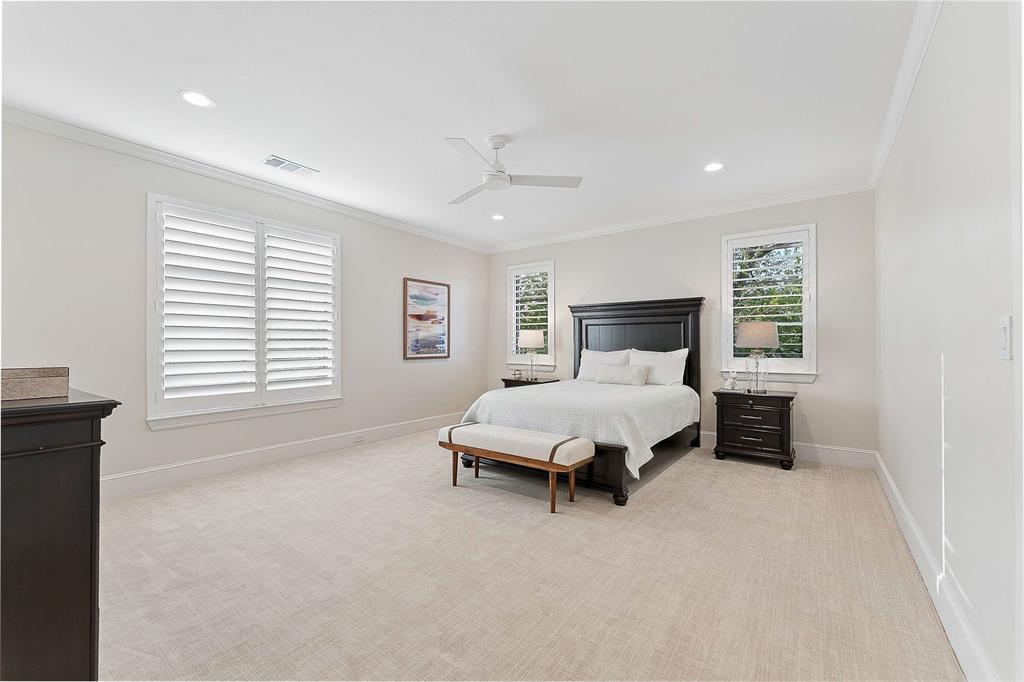 7110 Robin Road Dallas, TX 75209 - Photo 33 of 36 a spacious bedroom with a bed and a window