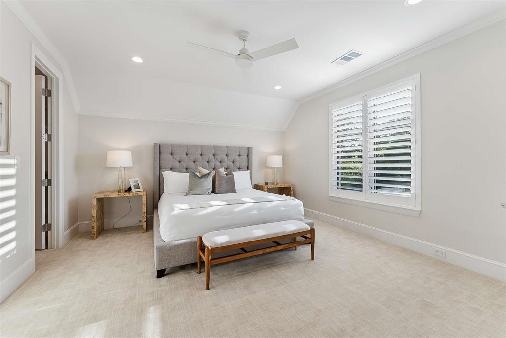 7110 Robin Road Dallas, TX 75209 - Photo 34 of 36 a bed sitting in a spacious bedroom next to a window