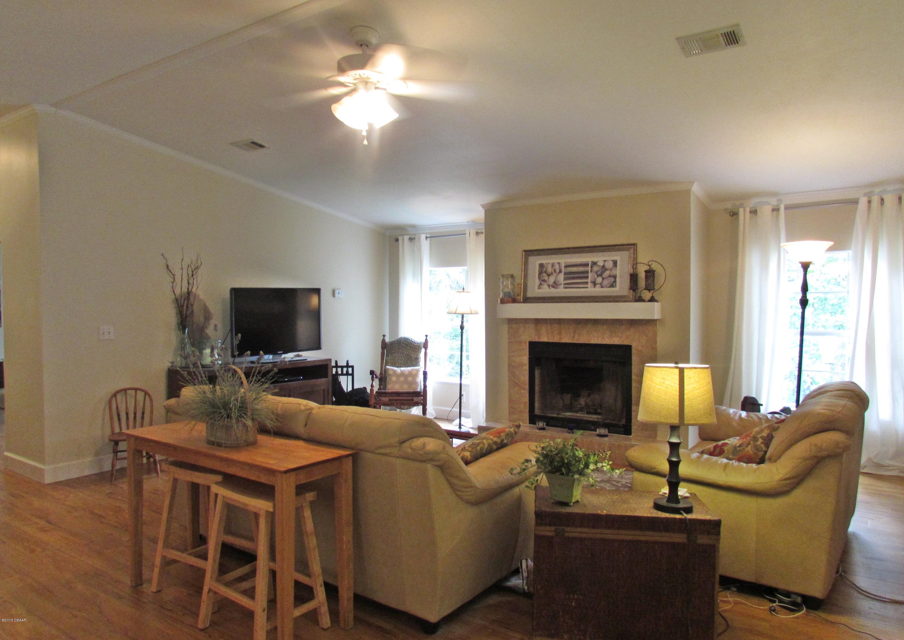 616 Vaughn Road Port Orange, FL 32127 - Photo 6 of 17 Living Room with Wood Burning Fireplace