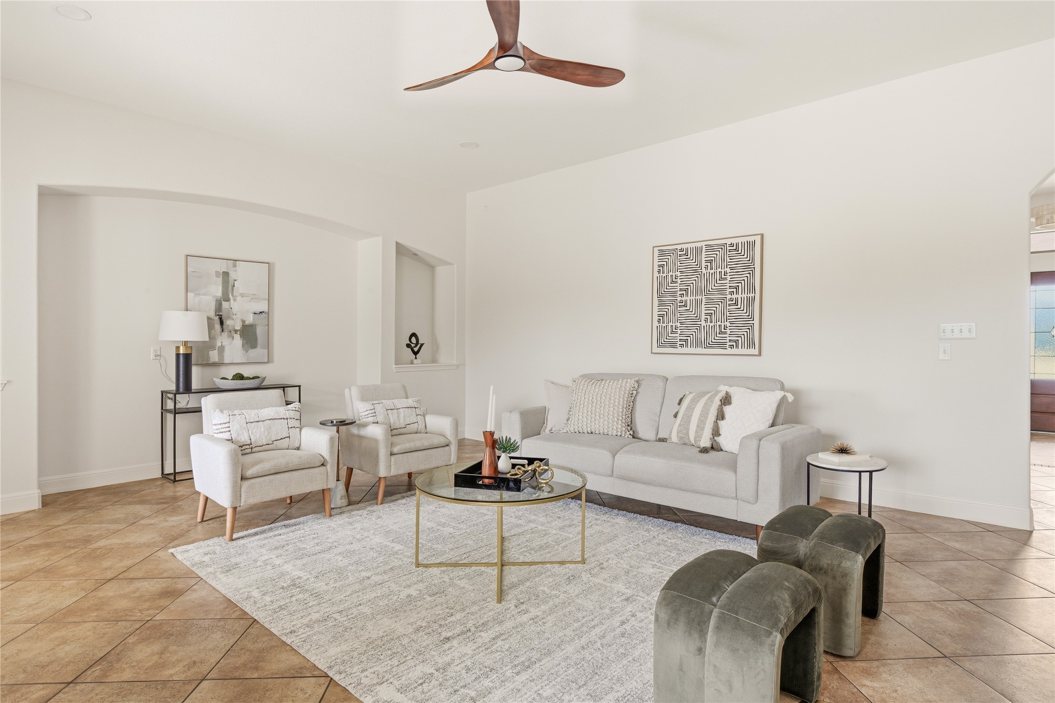 1432 Tom Sawyer Road Austin, TX 78737 - Photo 12 of 33 A well-lit living area showcases tile flooring and high ceilings, ideal for comfortable gatherings.
