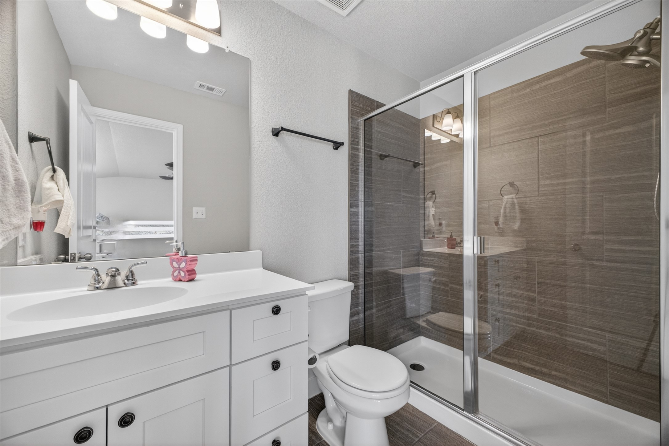 1009 Bright Star Cove Georgetown, TX 78628 - Photo 26 of 40 a bathroom with a sink toilet and shower