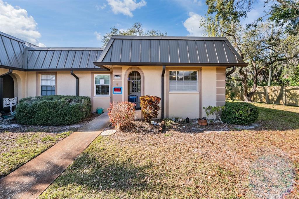 a front view of a house with garden