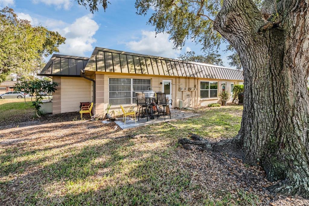 4450 Sunstate Drive New Port Richey, FL 34652 - Photo 19 of 29 a view of a house with backyard and sitting area