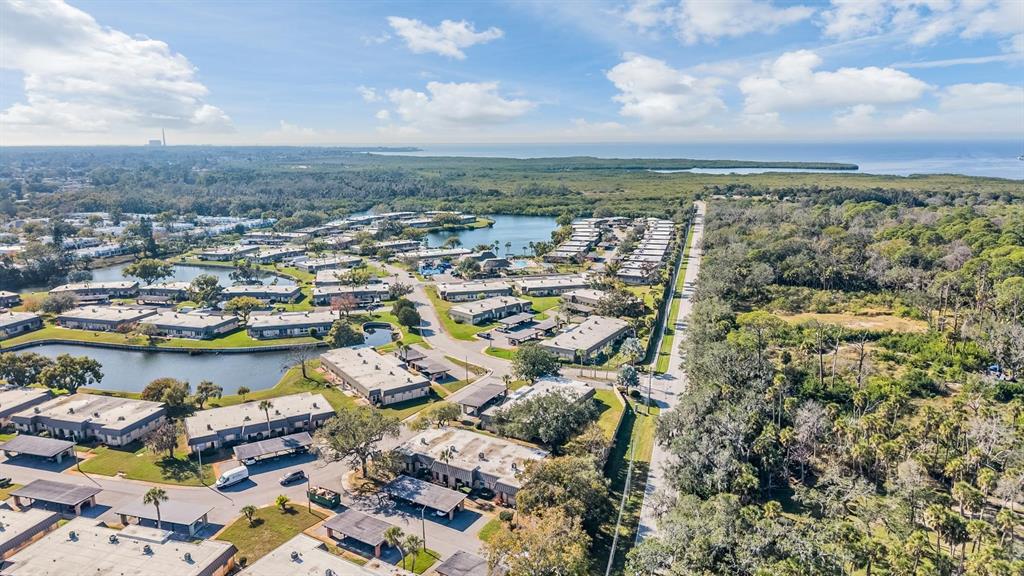 4450 Sunstate Drive New Port Richey, FL 34652 - Photo 26 of 29 an aerial view of residential building and lake