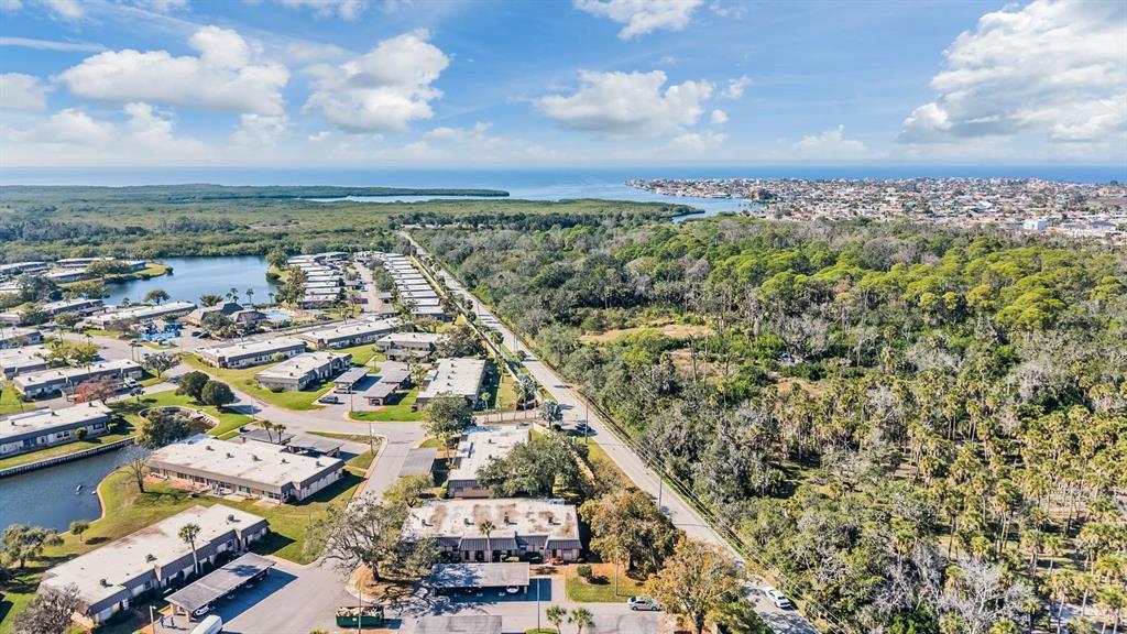 4450 Sunstate Drive New Port Richey, FL 34652 - Photo 27 of 29 an aerial view of residential building and lake