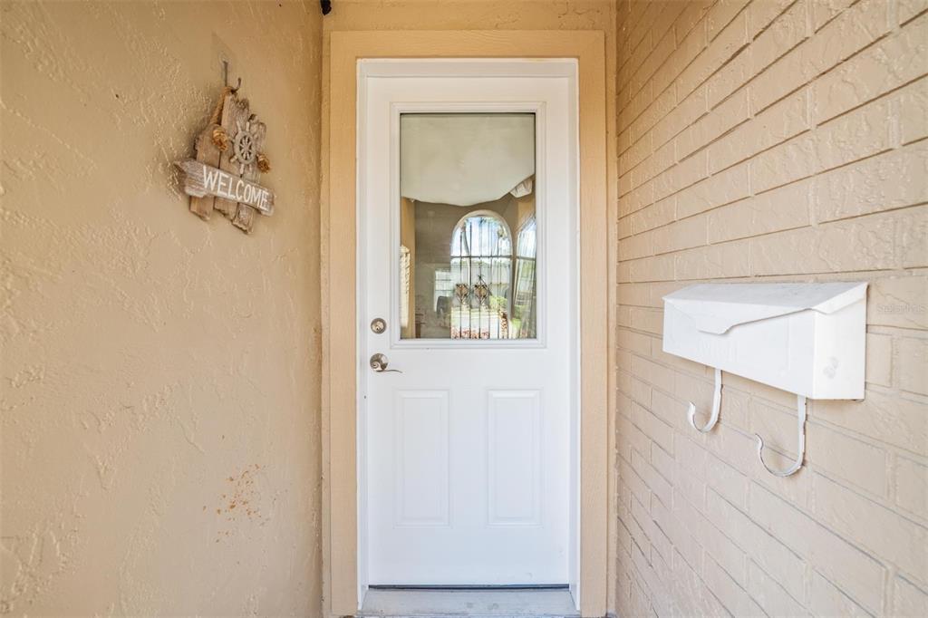 4450 Sunstate Drive New Port Richey, FL 34652 - Photo 3 of 29 a bathroom with a mirror and a sink