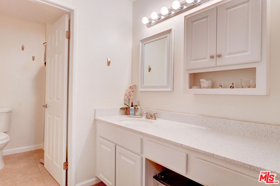 1275 Seacliff Court, Unit 5 Ventura, CA 93003 - Photo 13 of 25 a bathroom with a sink and a mirror