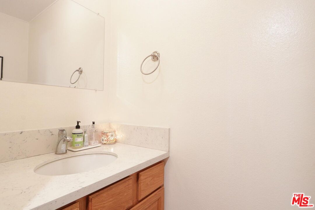 1275 Seacliff Court, Unit 5 Ventura, CA 93003 - Photo 8 of 25 a bathroom with a sink and a mirror