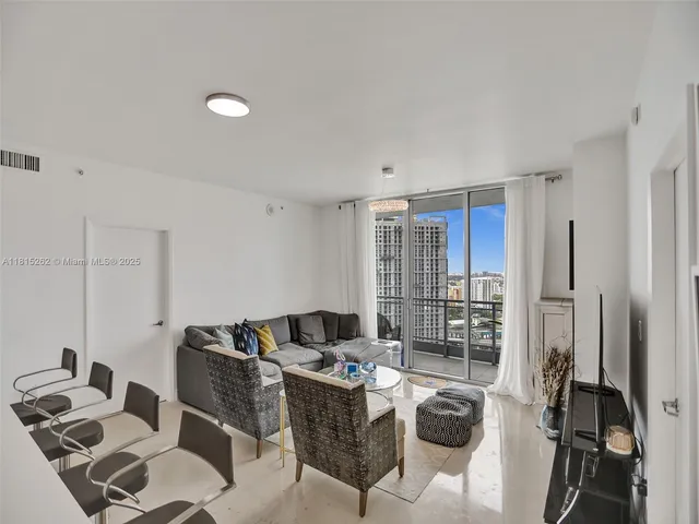 a bedroom with a bed and a lamp