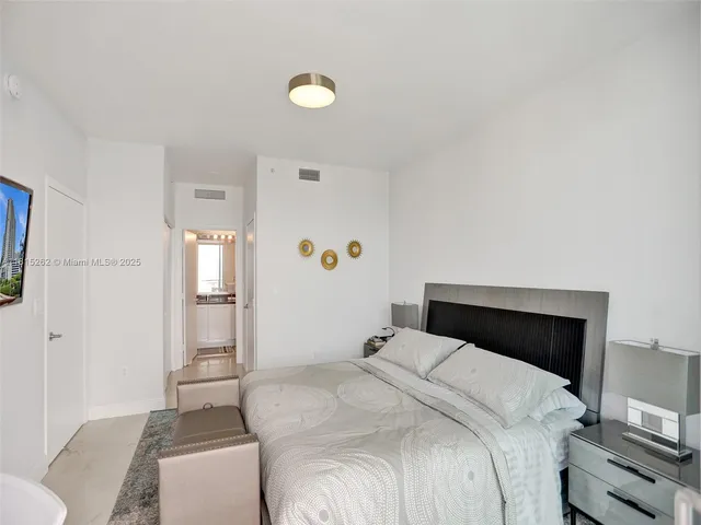 a bedroom with a bed and a cabinets