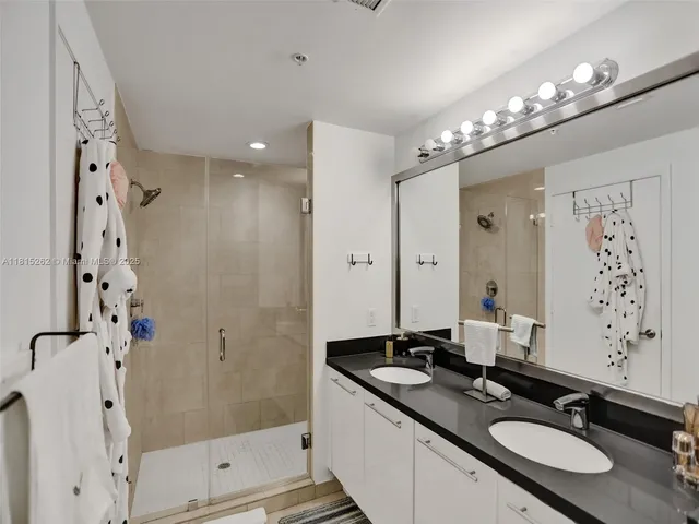 a bedroom with a bed and a lamp