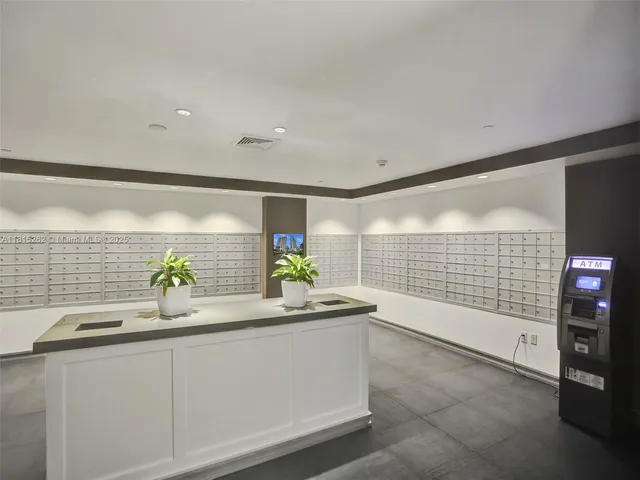 a view of swimming pool with outdoor seating and buildings in the background