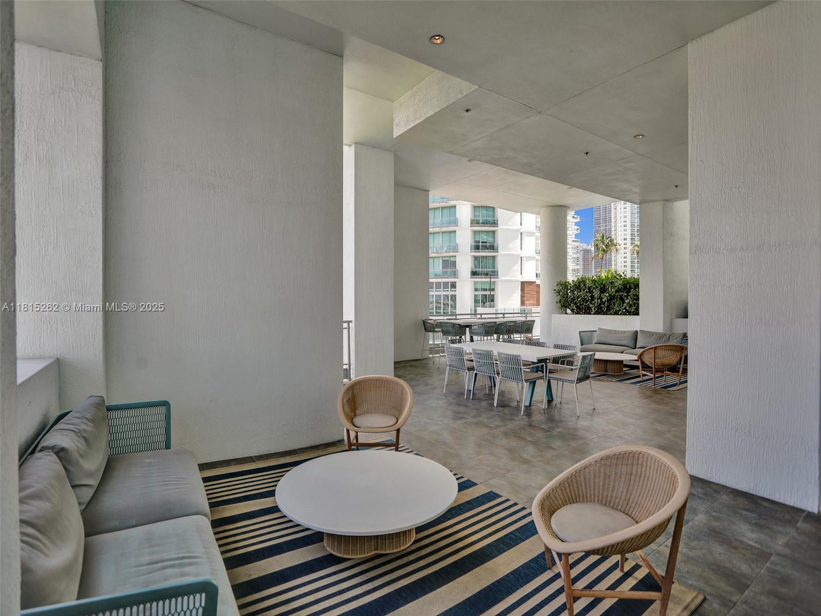 90 Southwest 3rd Street, Unit 2809 Miami, FL 33130 - Photo 45 of 67 a living room with furniture and a table