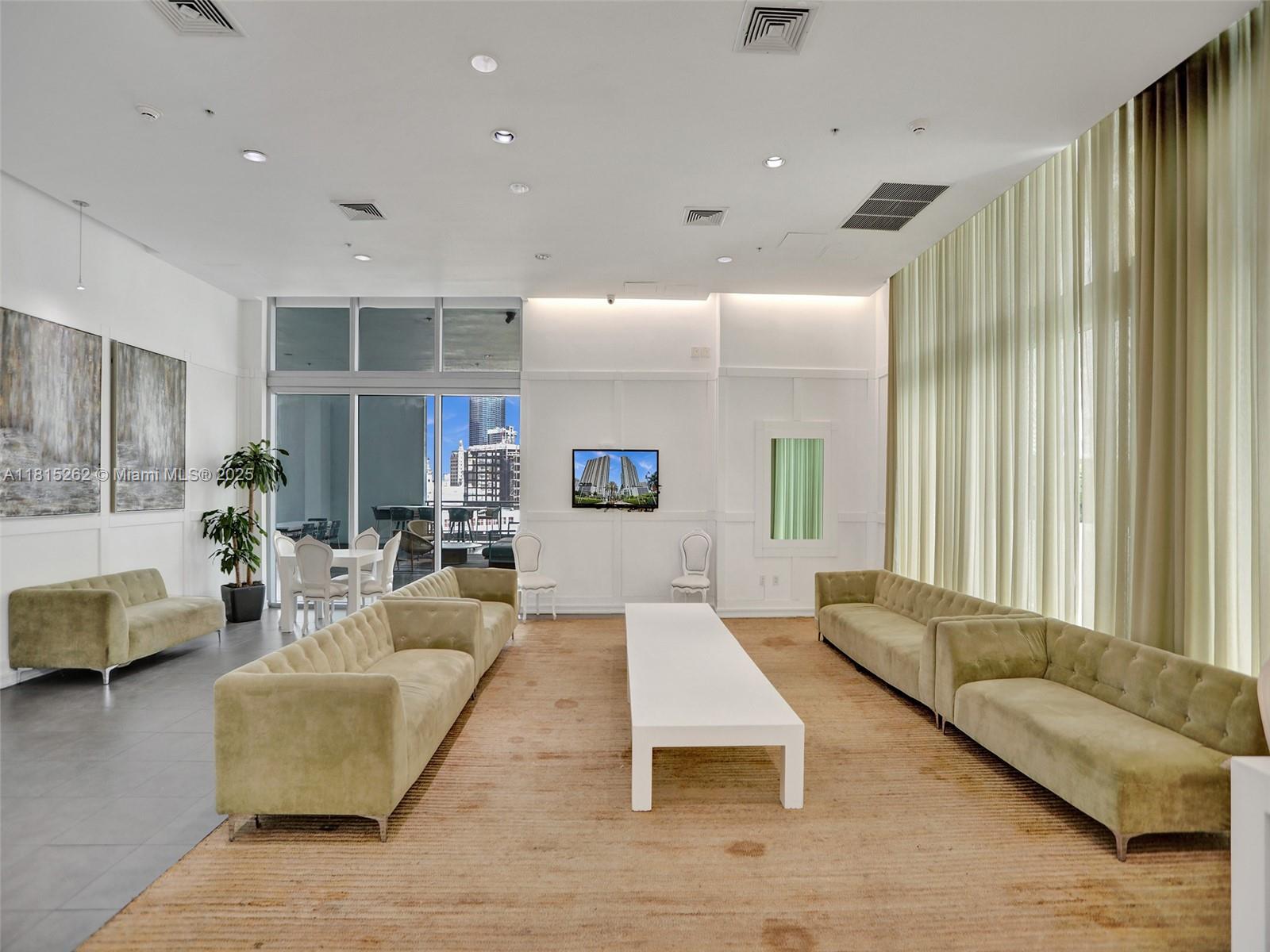 90 Southwest 3rd Street, Unit 2809 Miami, FL 33130 - Photo 47 of 67 a living room with furniture and a large window