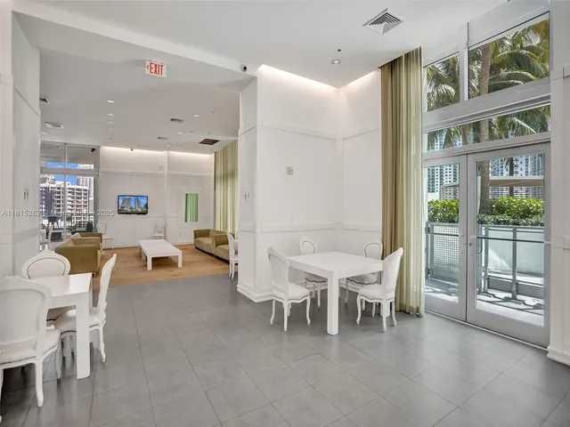 a view of a street with a cars park both side of a building