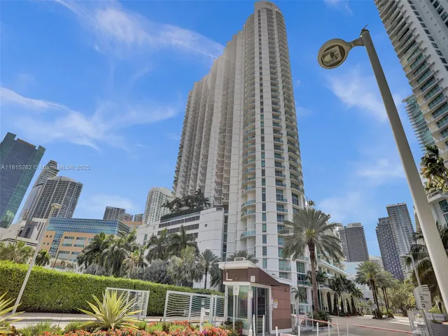 a kitchen with stainless steel appliances a refrigerator sink and stove