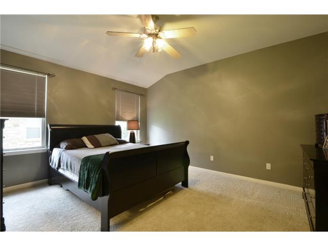 11612 Timber Heights Drive Austin, TX 78754 - Photo 14 of 28 These walls have been painted with neutral color. Sloping ceilings and a plush carpeted floor create a cozy retreat in this ample sleeping chamber.