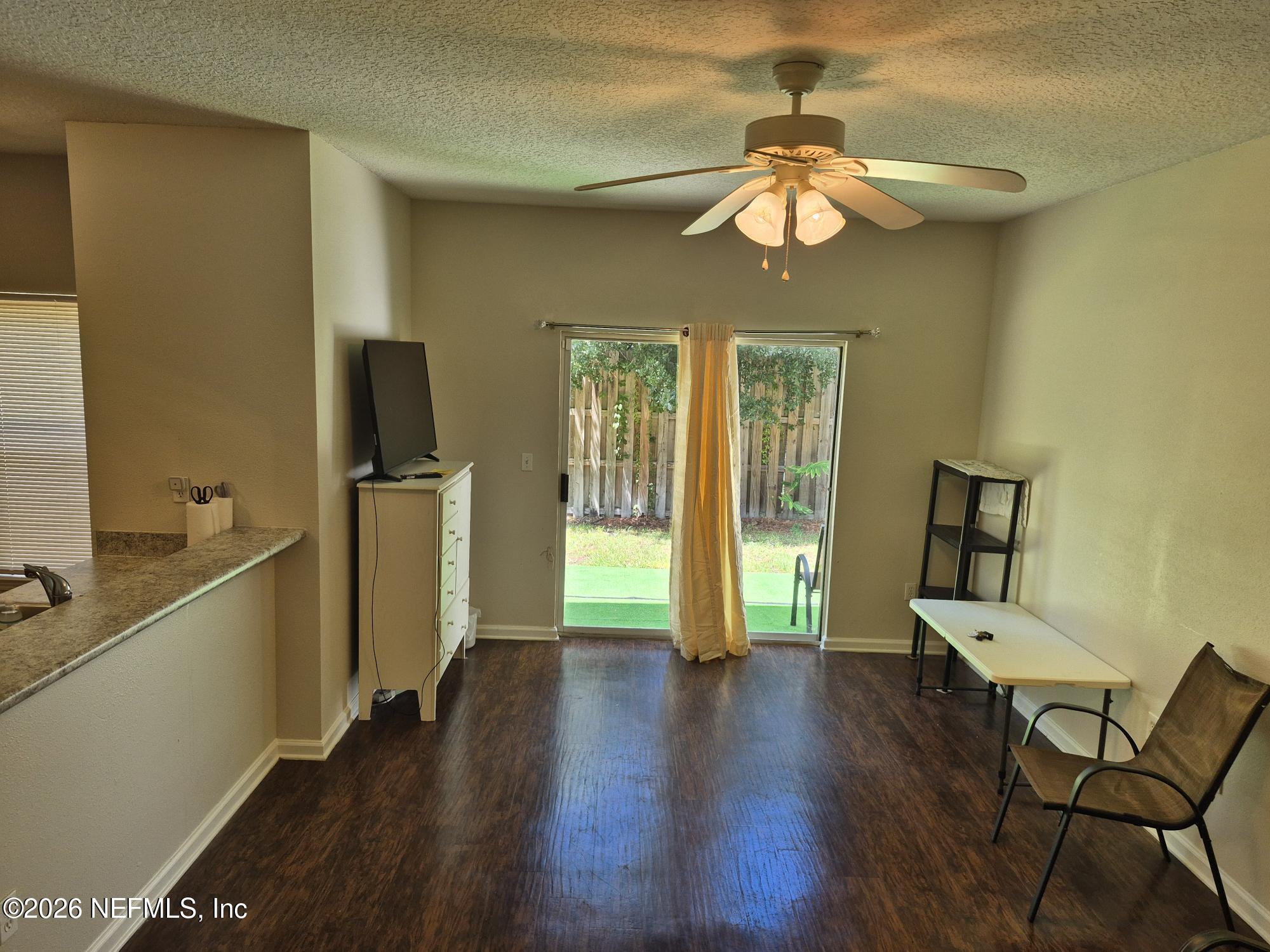 5260 Collins Road, Unit 1501 Jacksonville, FL 32244 - Photo 6 of 18 Living Area to Patio