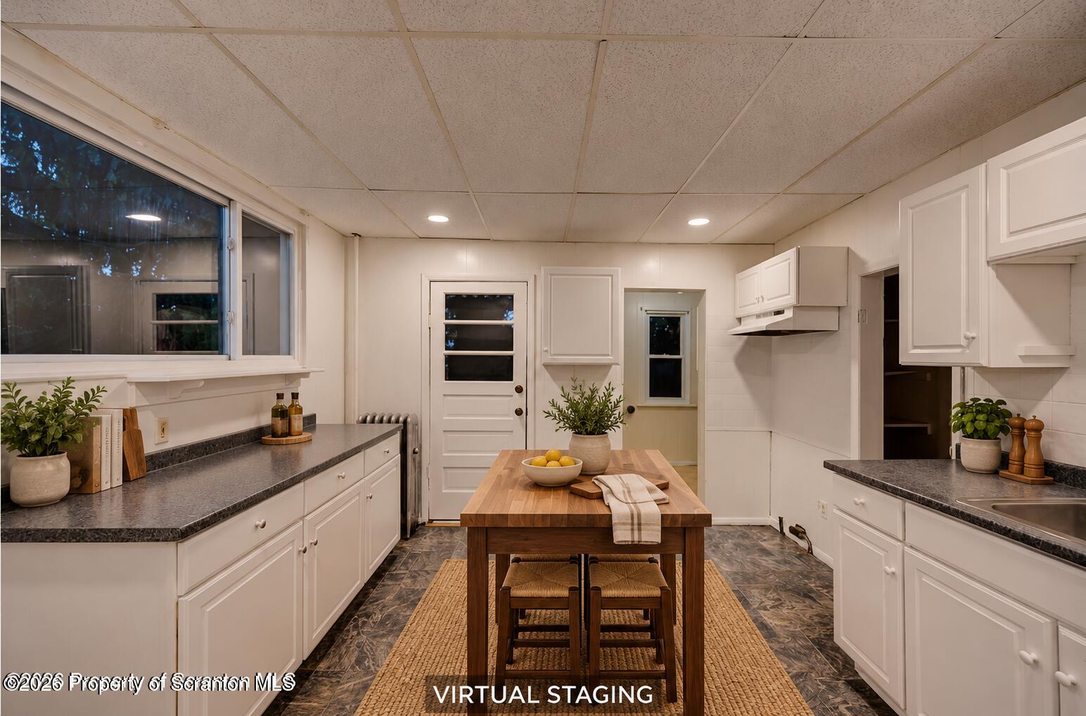 819 Delaware Street Scranton, PA 18509 - Photo 20 of 45 Warmly staged kitchen with walnut island