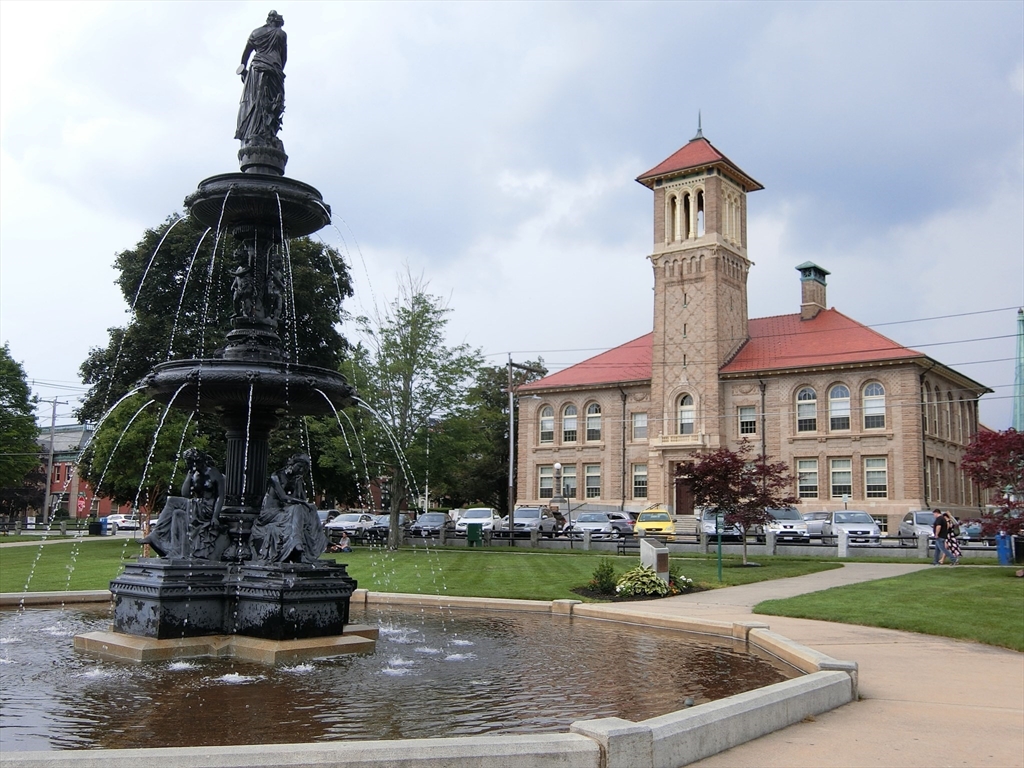7 High Street, Unit 11 Clinton, MA 01510 - Photo 16 of 17 a front view of a house with a yard