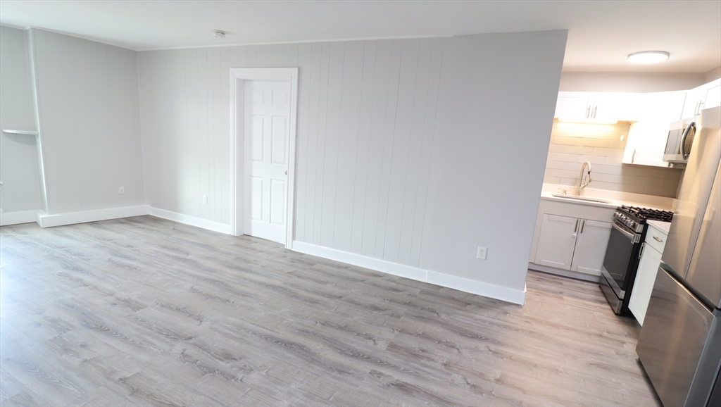 7 High Street, Unit 11 Clinton, MA 01510 - Photo 4 of 17 a view of a kitchen with a sink and a stove