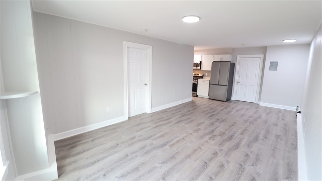 7 High Street, Unit 11 Clinton, MA 01510 - Photo 7 of 17 a view of empty room with wooden floor