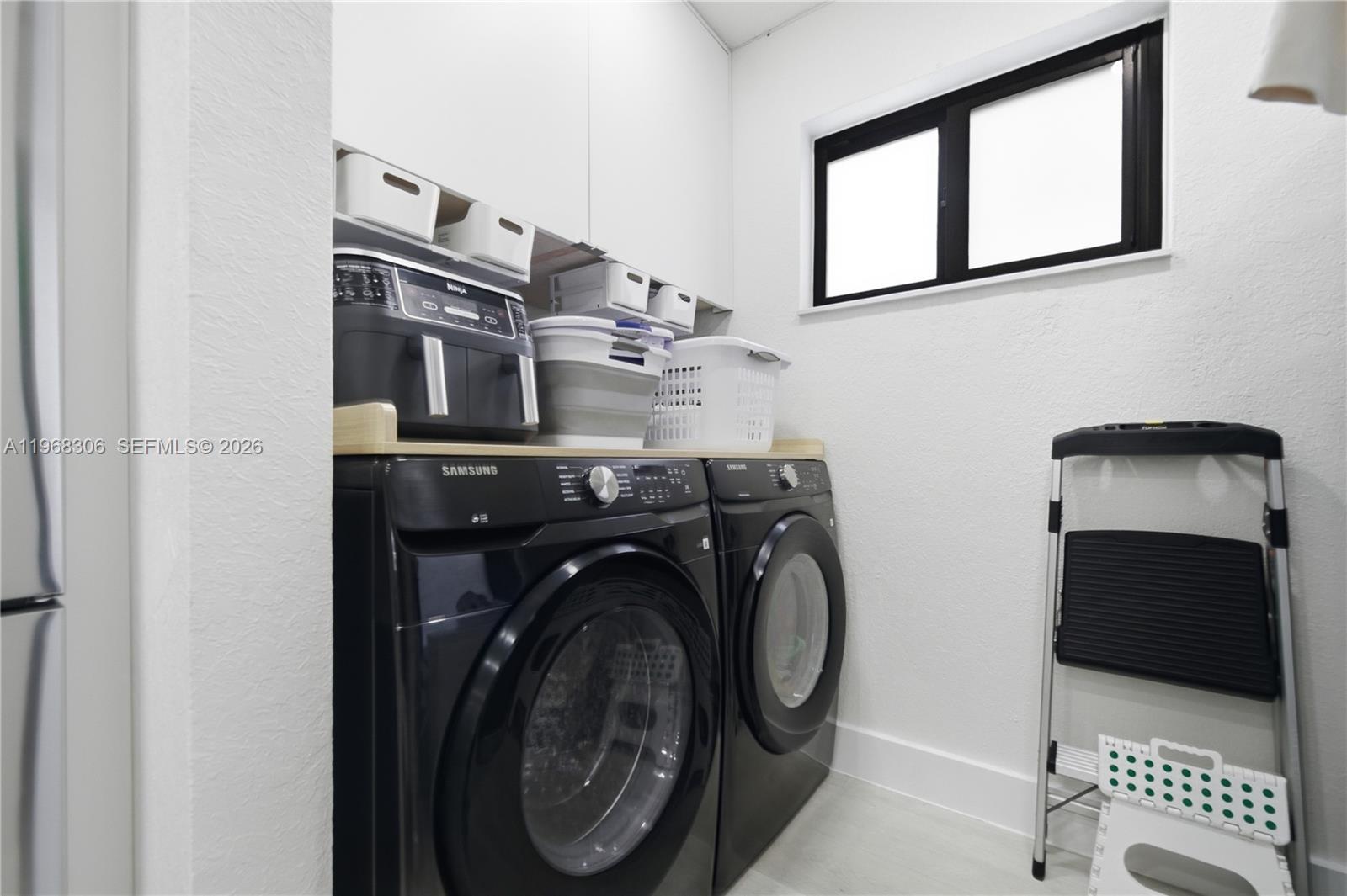 7491 Raleigh Street Hollywood, FL 33024 - Photo 14 of 28 a utility room with dryer and washer