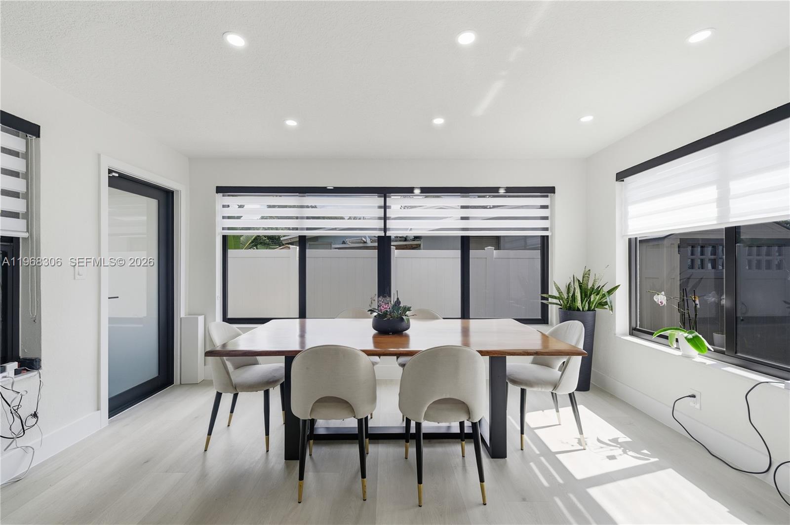7491 Raleigh Street Hollywood, FL 33024 - Photo 15 of 28 a dining room with furniture and window