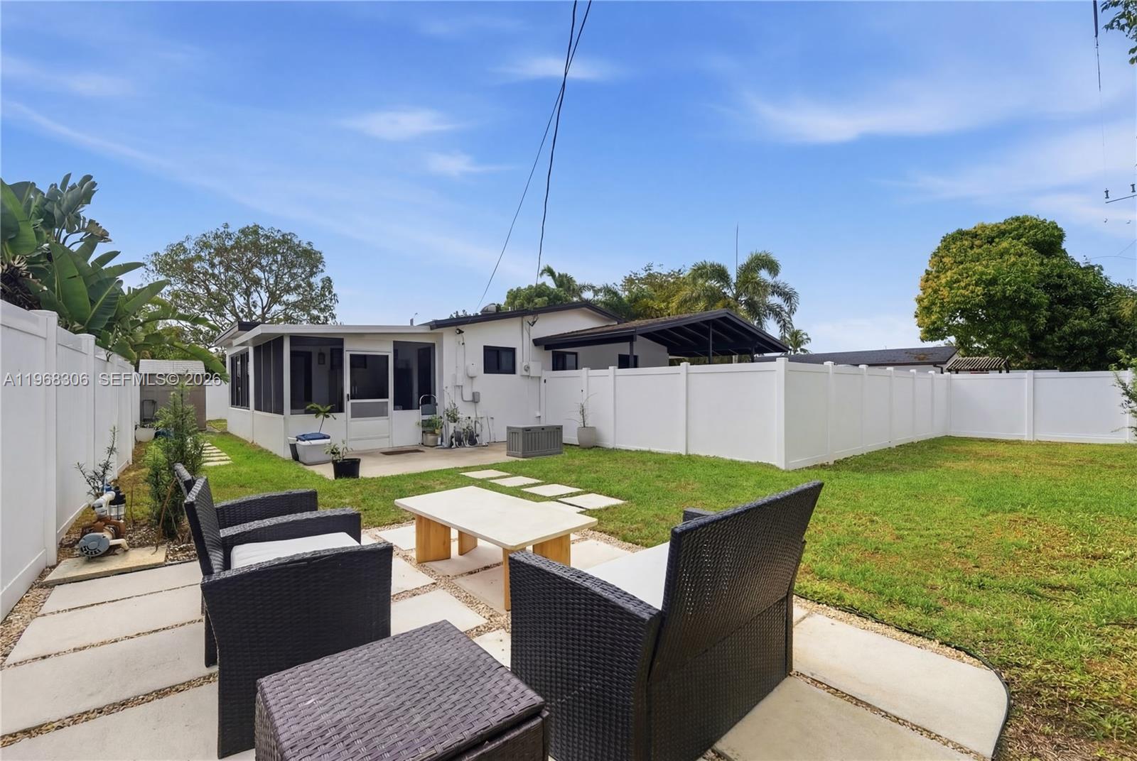 7491 Raleigh Street Hollywood, FL 33024 - Photo 19 of 28 a view of a house with backyard and sitting area