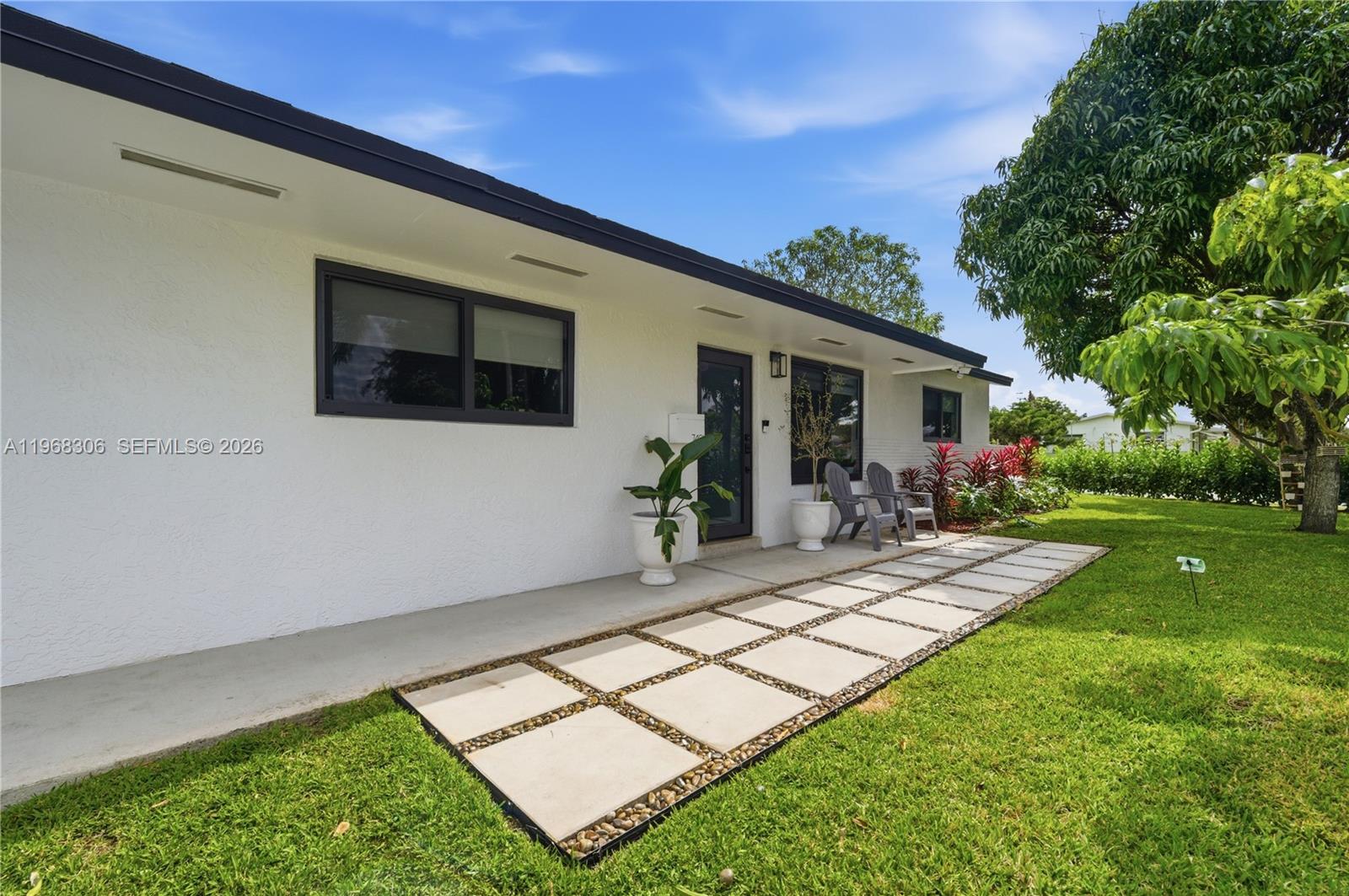 7491 Raleigh Street Hollywood, FL 33024 - Photo 25 of 28 a view of house and yard with swimming pool