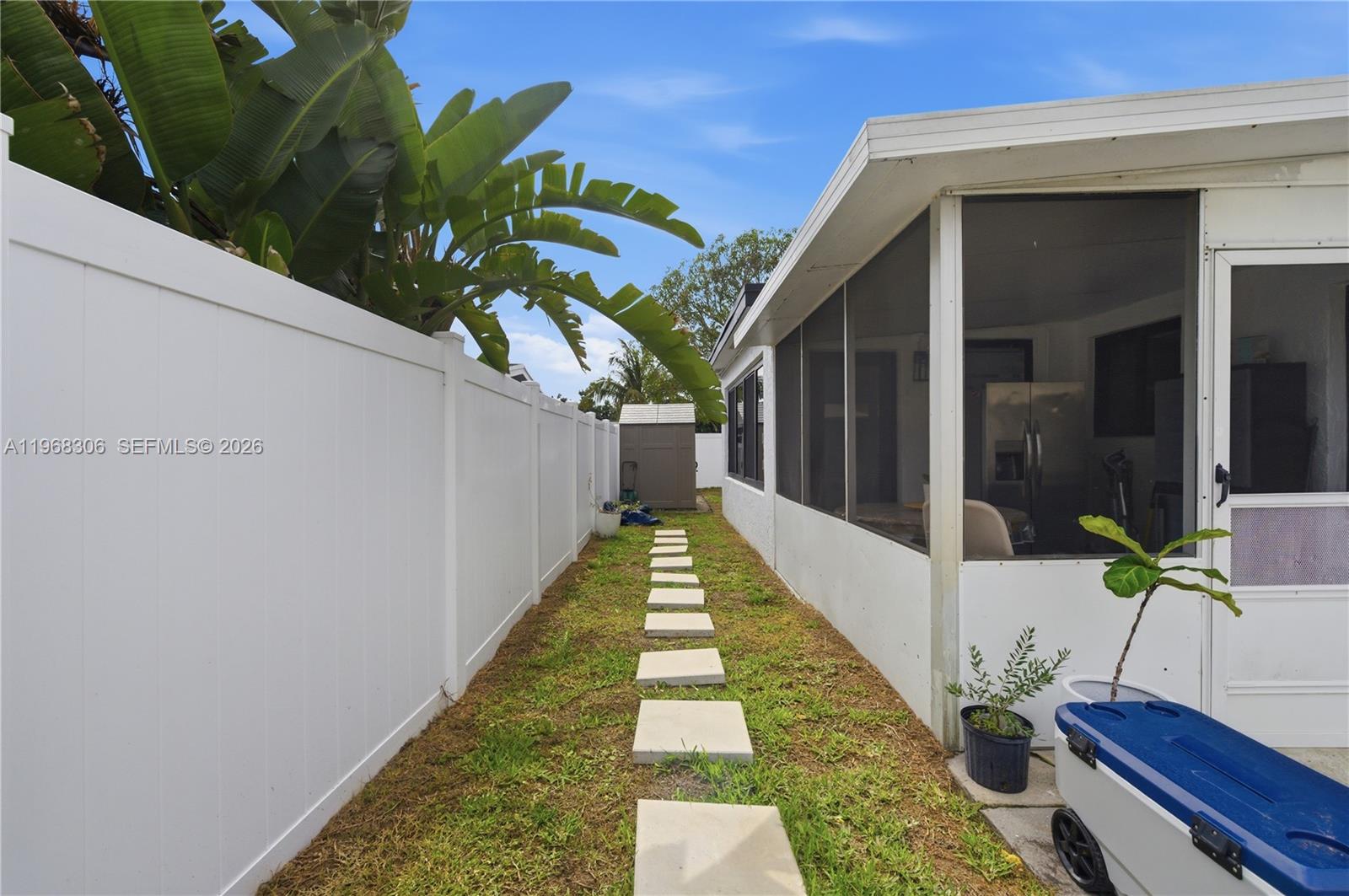7491 Raleigh Street Hollywood, FL 33024 - Photo 26 of 28 a view of balcony with wooden floor and a potted plant