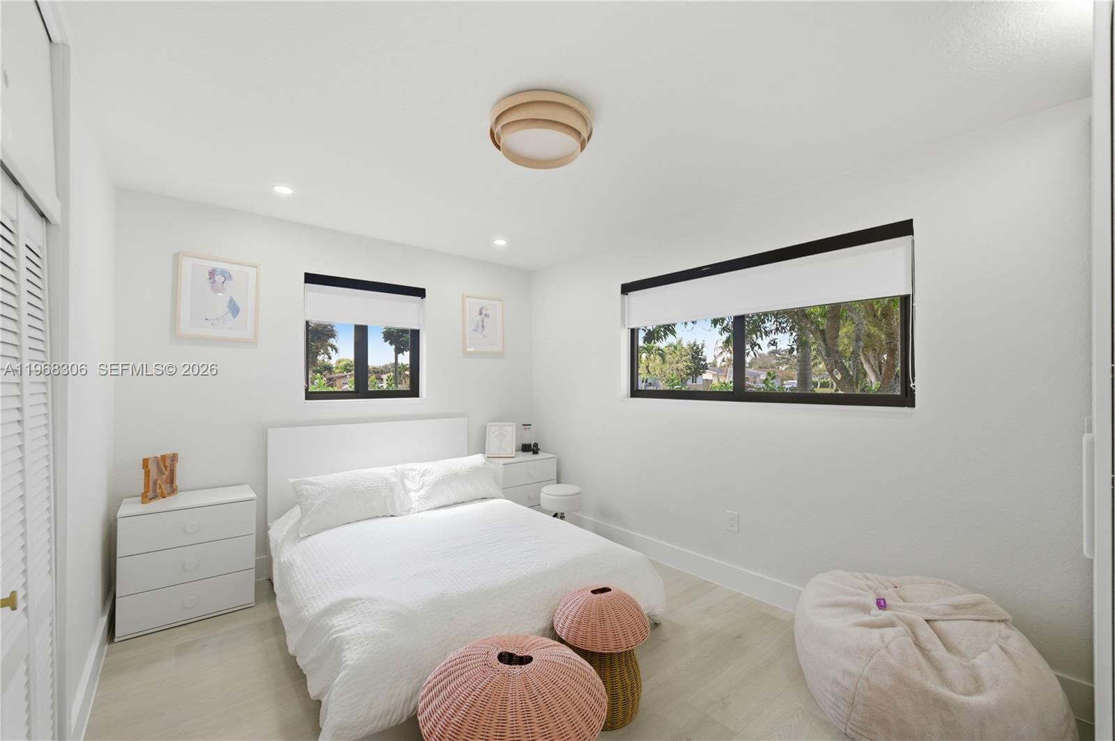 7491 Raleigh Street Hollywood, FL 33024 - Photo 4 of 28 a bedroom with a bed and furniture