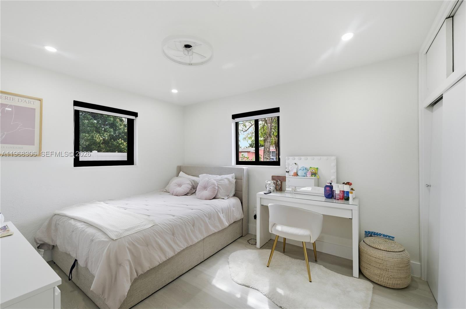 7491 Raleigh Street Hollywood, FL 33024 - Photo 5 of 28 a bedroom with a bed and a table