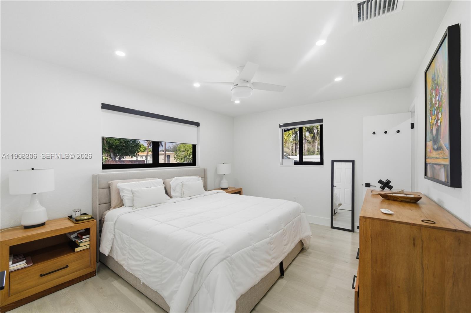 7491 Raleigh Street Hollywood, FL 33024 - Photo 8 of 28 a bedroom with a bed and a desk