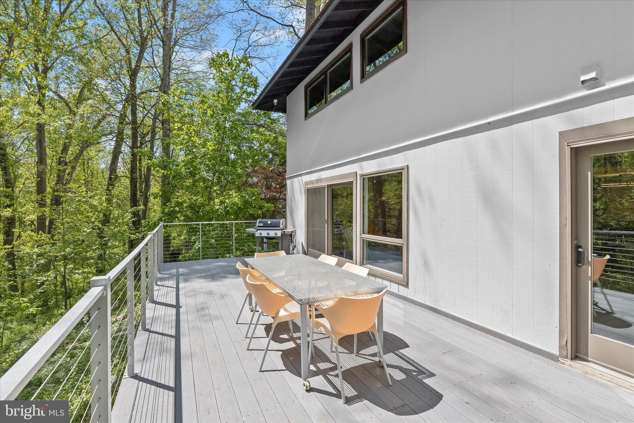 927 Buckhorn Road Sykesville, MD 21784 - Photo 67 of 147 a view of a patio with table and chairs with wooden floor and fence