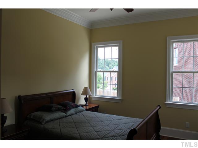 2108 Tulare Court Raleigh, NC 27612 - Photo 11 of 25 a bedroom with a bed and a window