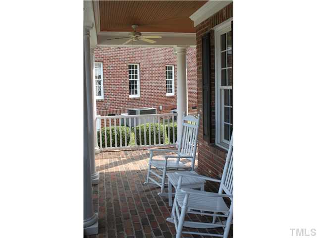 2108 Tulare Court Raleigh, NC 27612 - Photo 2 of 25 a view of a porch with a table and chairs