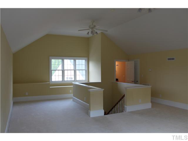 2108 Tulare Court Raleigh, NC 27612 - Photo 24 of 25 a living room with furniture and a wooden floor