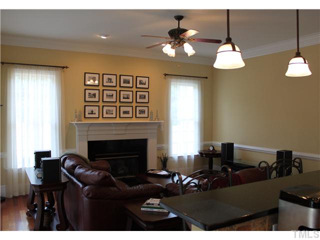 2108 Tulare Court Raleigh, NC 27612 - Photo 7 of 25 a living room with furniture and a fireplace
