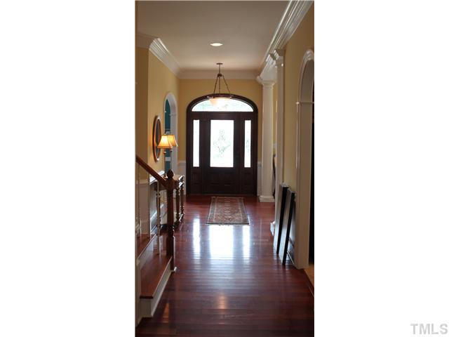 2108 Tulare Court Raleigh, NC 27612 - Photo 9 of 25 a hallway with table and a potted plants
