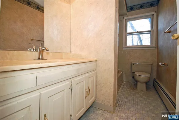 a bathroom with a sink and a toilet