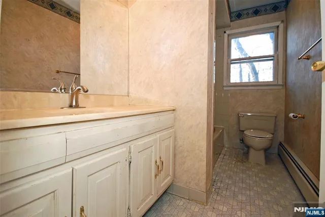a bathroom with a sink and a toilet
