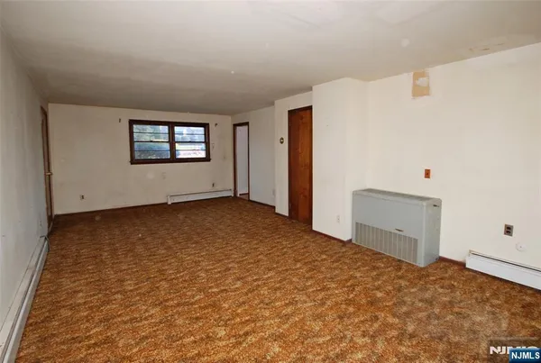 a view of a room with window and stairs